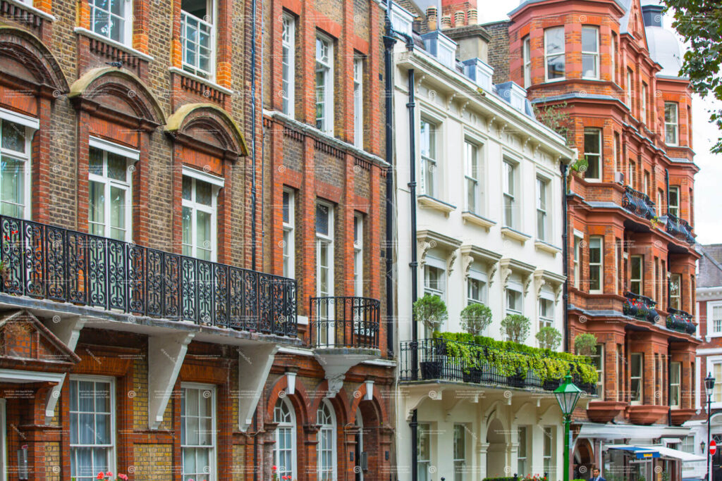Kensington London street with period buildings and tree lined road