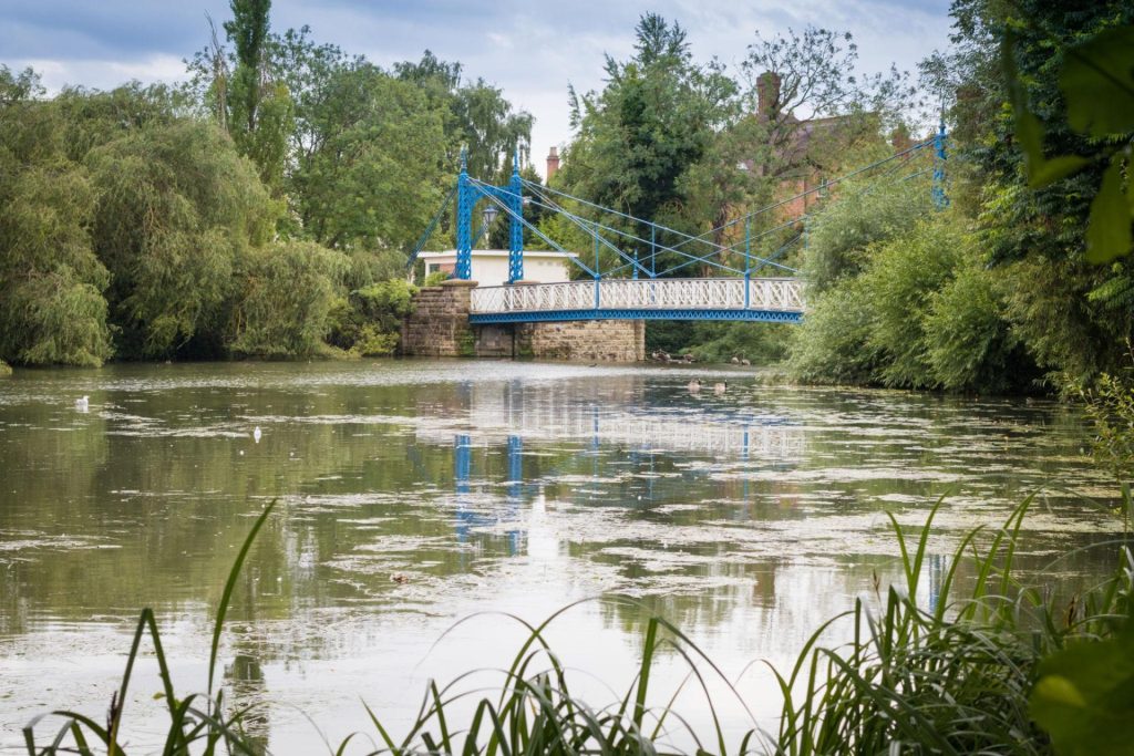 Jephson Gardens in Leamington Spa showing riverside green space and Regency architecture