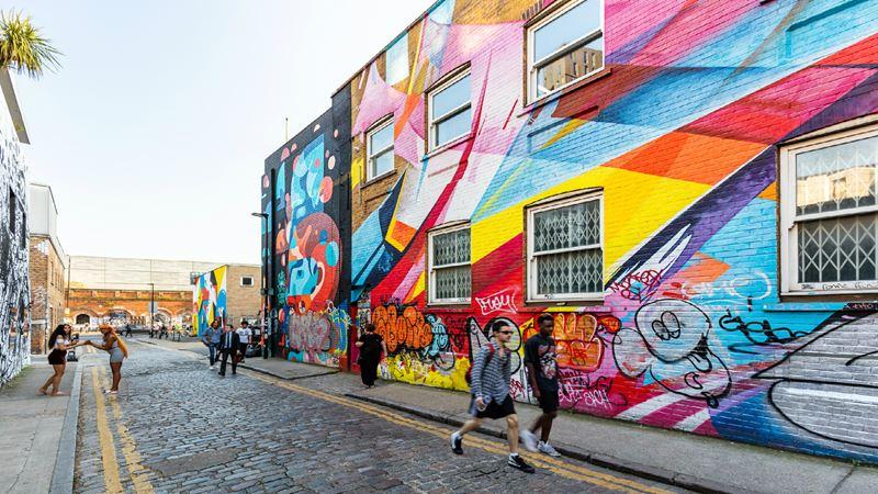 Colourful street art in Shoreditch showing graffiti and urban culture